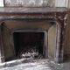 Louis XIV style fireplace in veined Carrara marble and 19th-century ceramics.