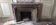 Louis XIV style fireplace in veined Carrara marble and 19th-century ceramics.