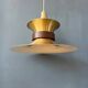 Large UFO flying saucer pendant light with orange light.
