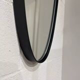 Free-form rearview mirror in black metal