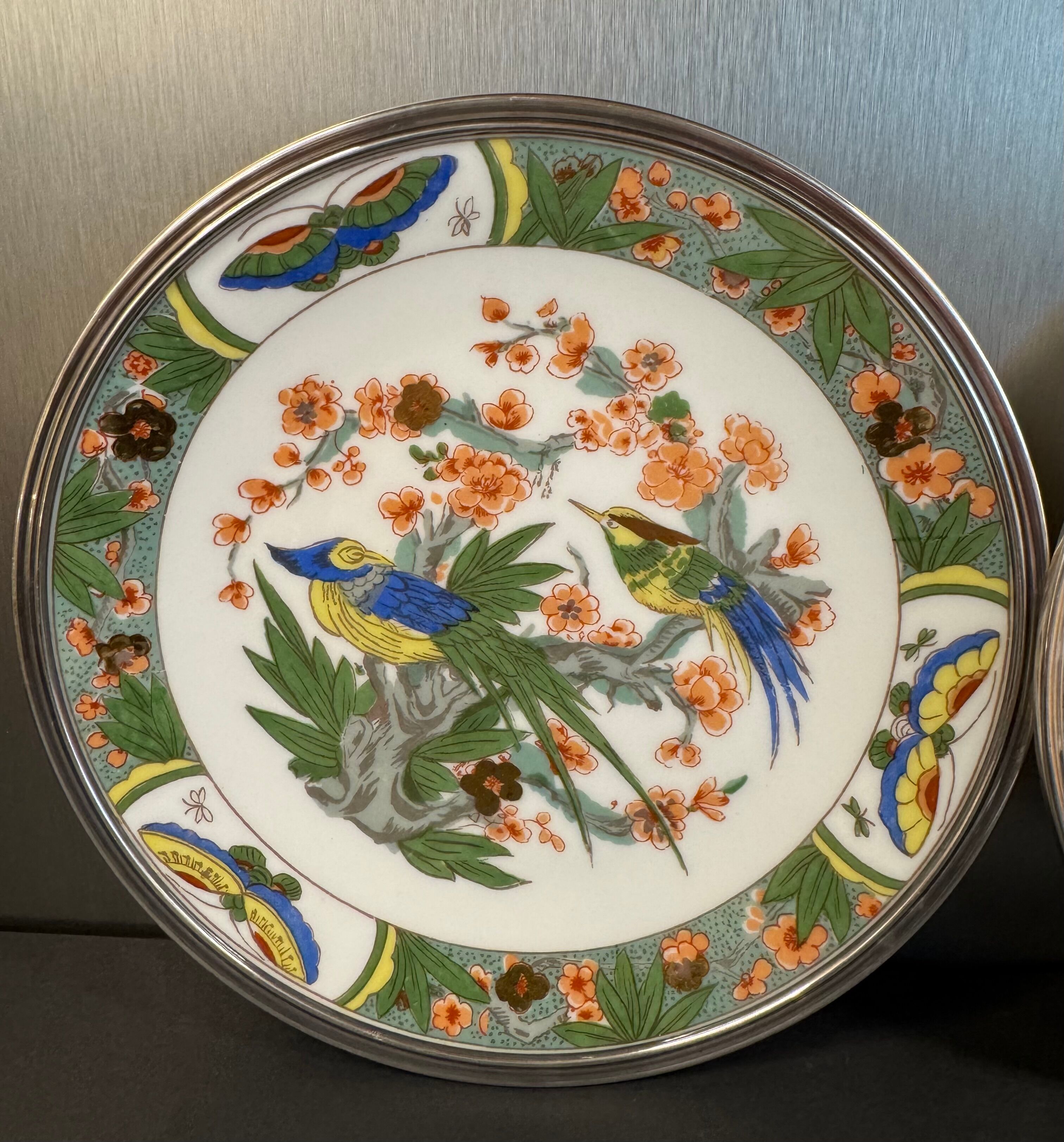 Two Raynaud Limoges plates and Tetard brothers silver.