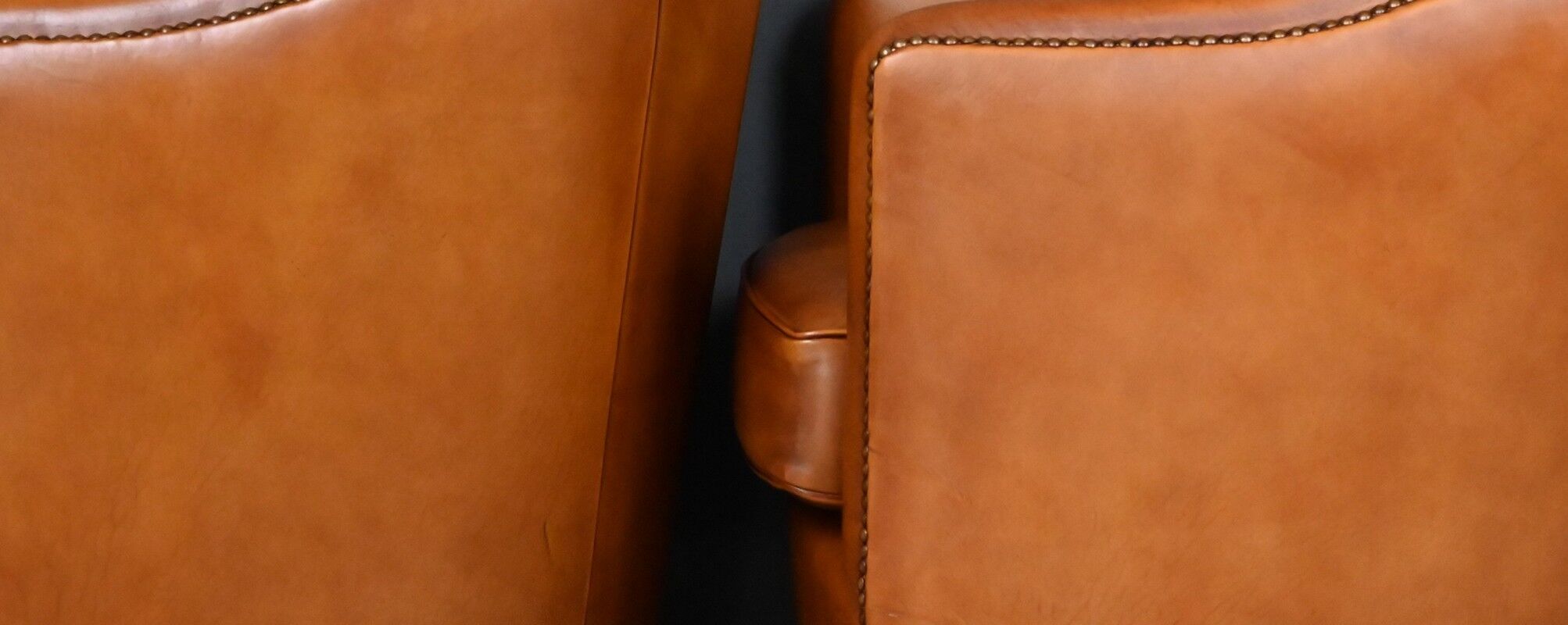 Pair of Solange club armchairs in sheepskin leather – reproduction