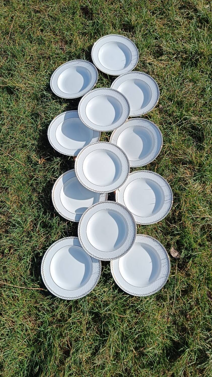 Twelve white porcelain plates