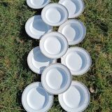 Twelve white porcelain plates