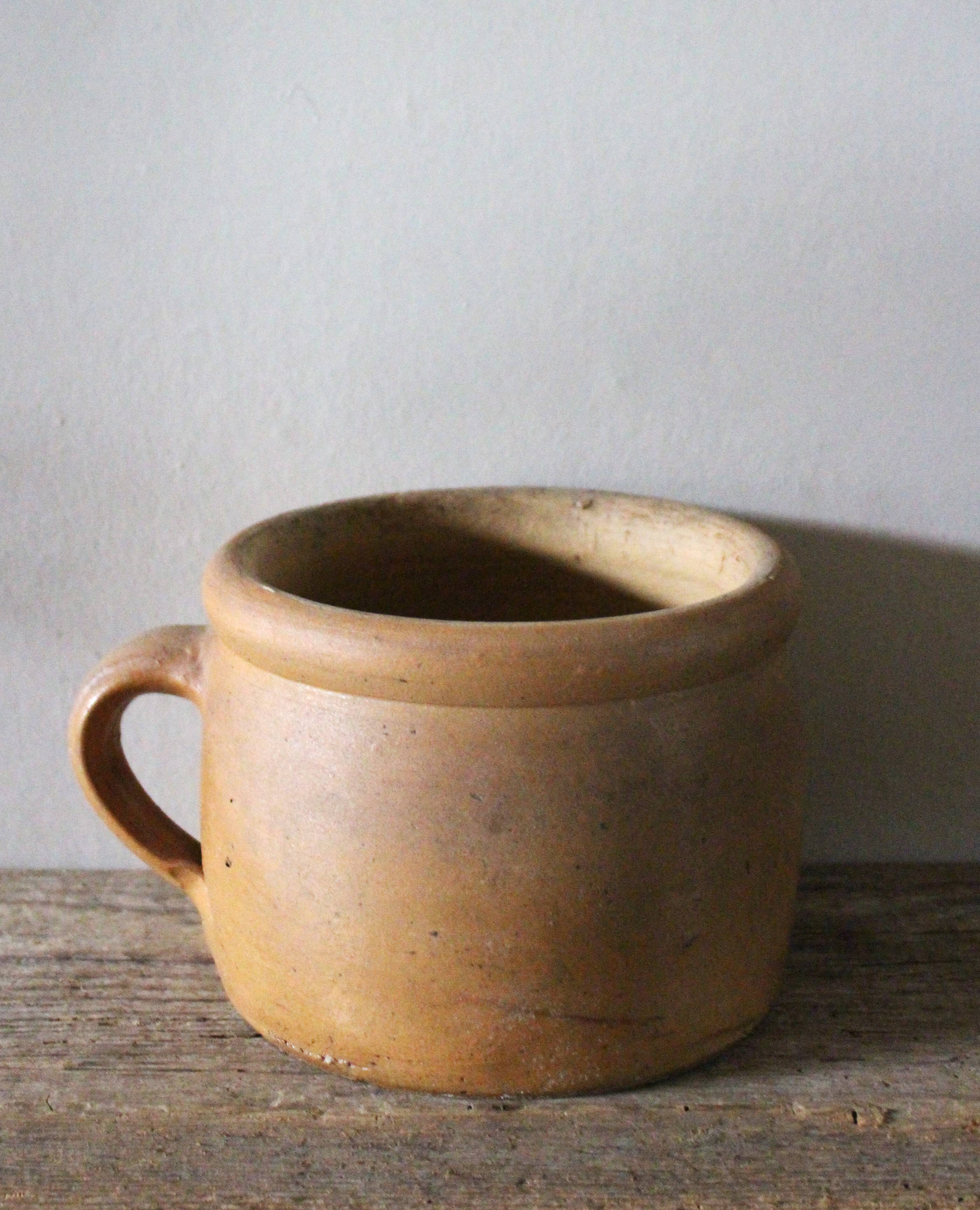 Round terracotta milk jug with handle