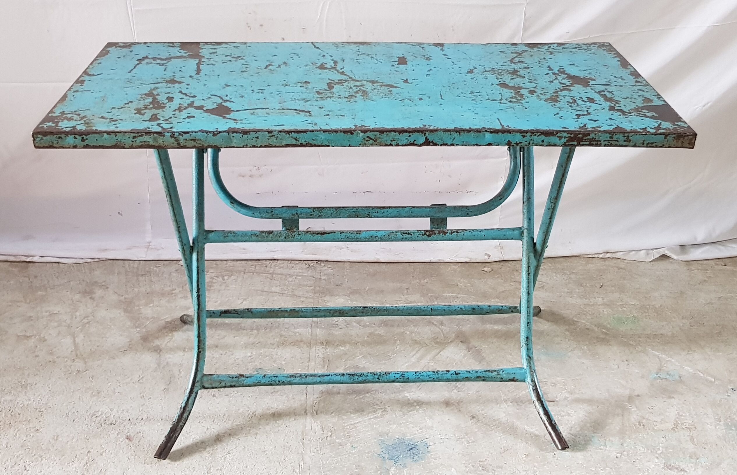 Old metal folding table with its original turquoise patina