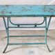Old metal folding table with its original turquoise patina