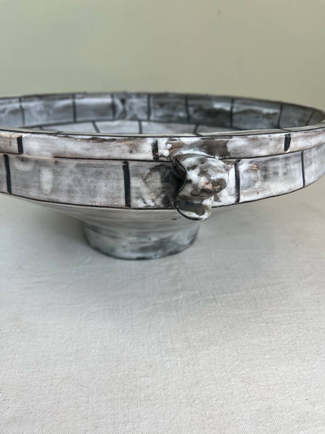 Handcrafted glazed ceramic architectural cup