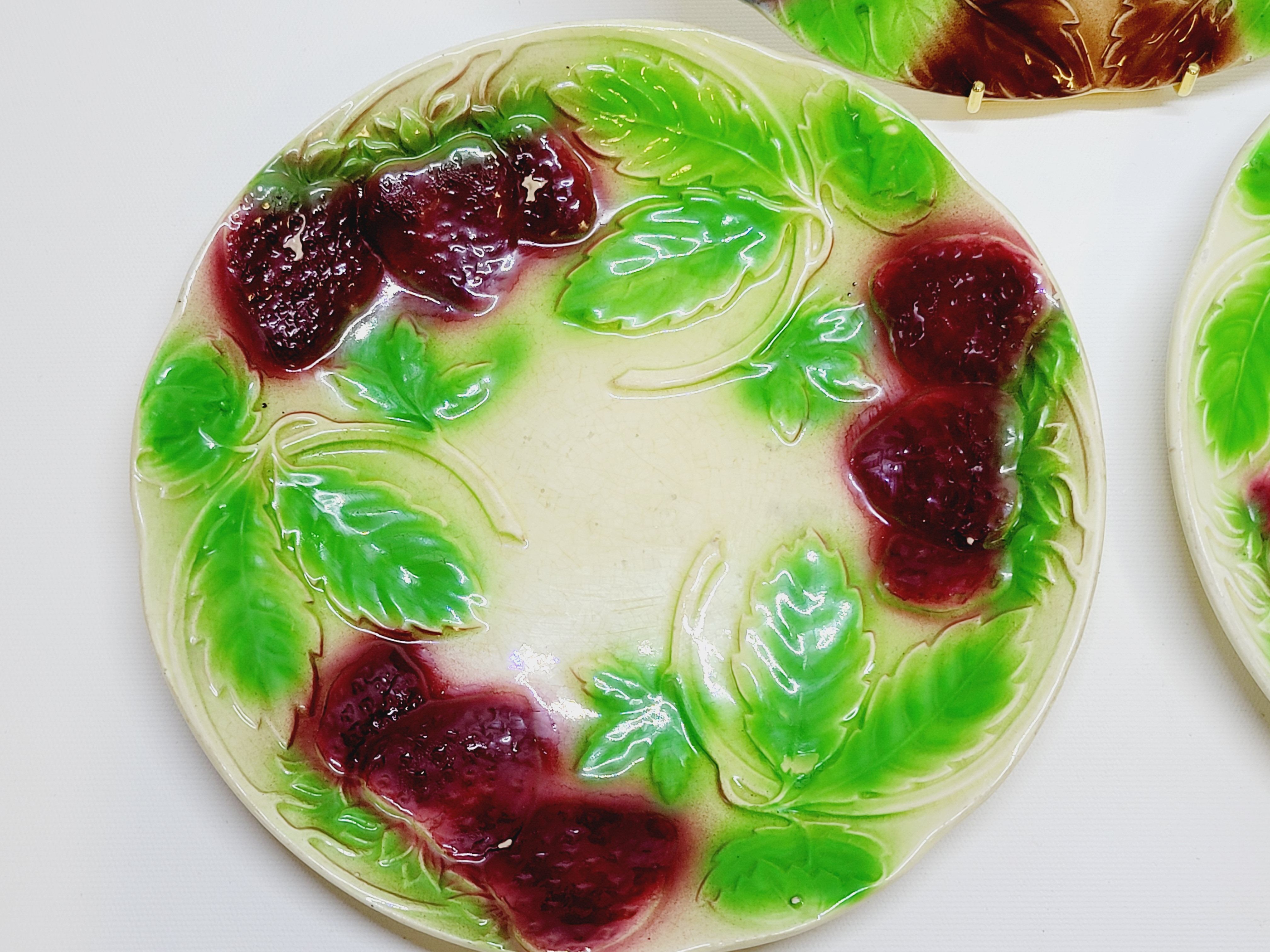3 old plates in slip decoration strawberries and grapes