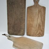 three vintage patinated solid wood cutting boards