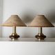 Lot of 2 vintage table lamps from the 1970s, dark wood oval bases with curved brass details, handmade natural fibre lampshades, elegant lighting.