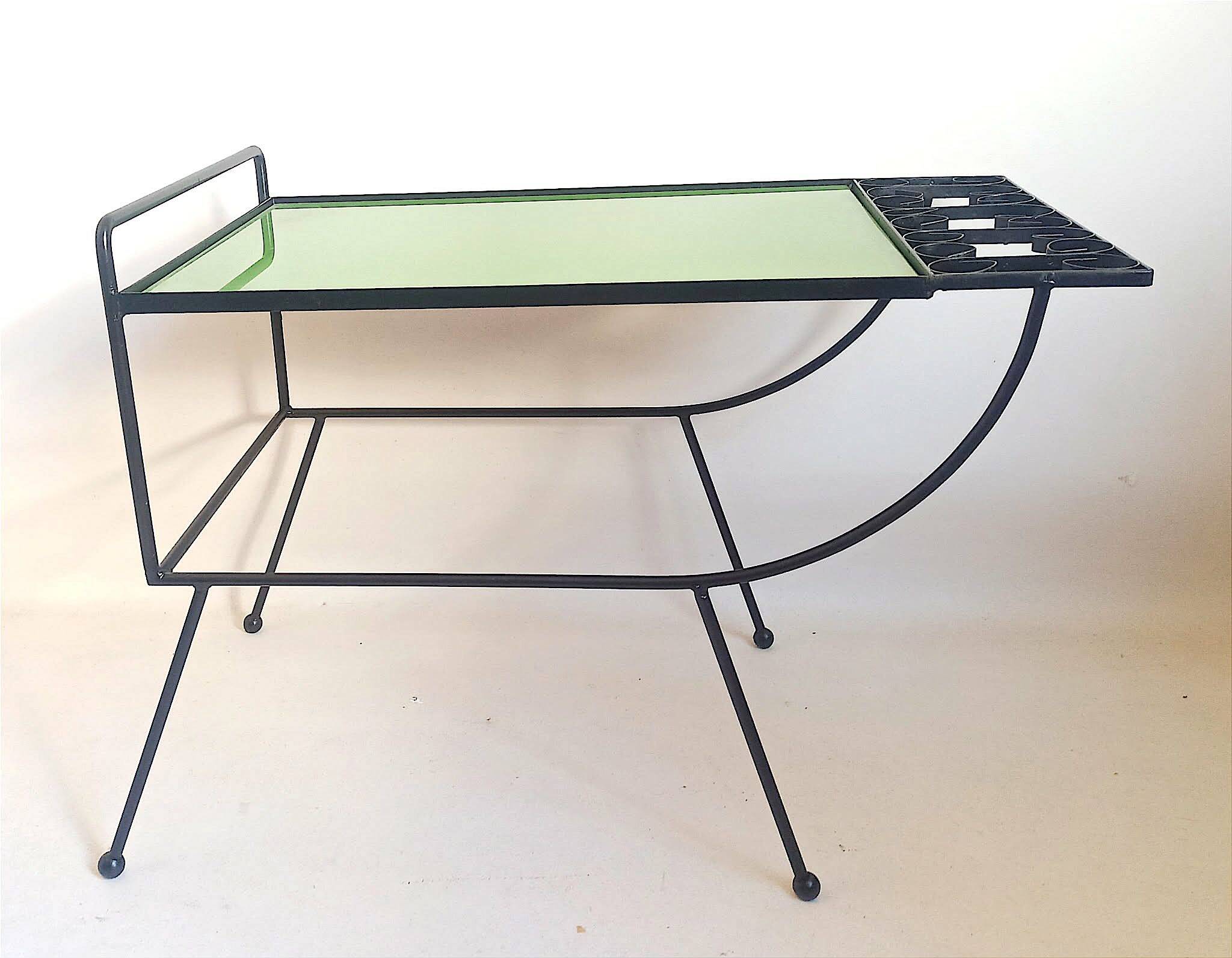 1960s side table with a lime green top, width 65.5 cm.