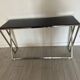 Designer console in glass and metal