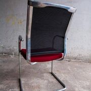 Set of 4 cantilever chairs with burgundy seat and mesh backrest.