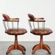 Set of 2 swivel/office chairs with a cognac-coloured cow leather seat