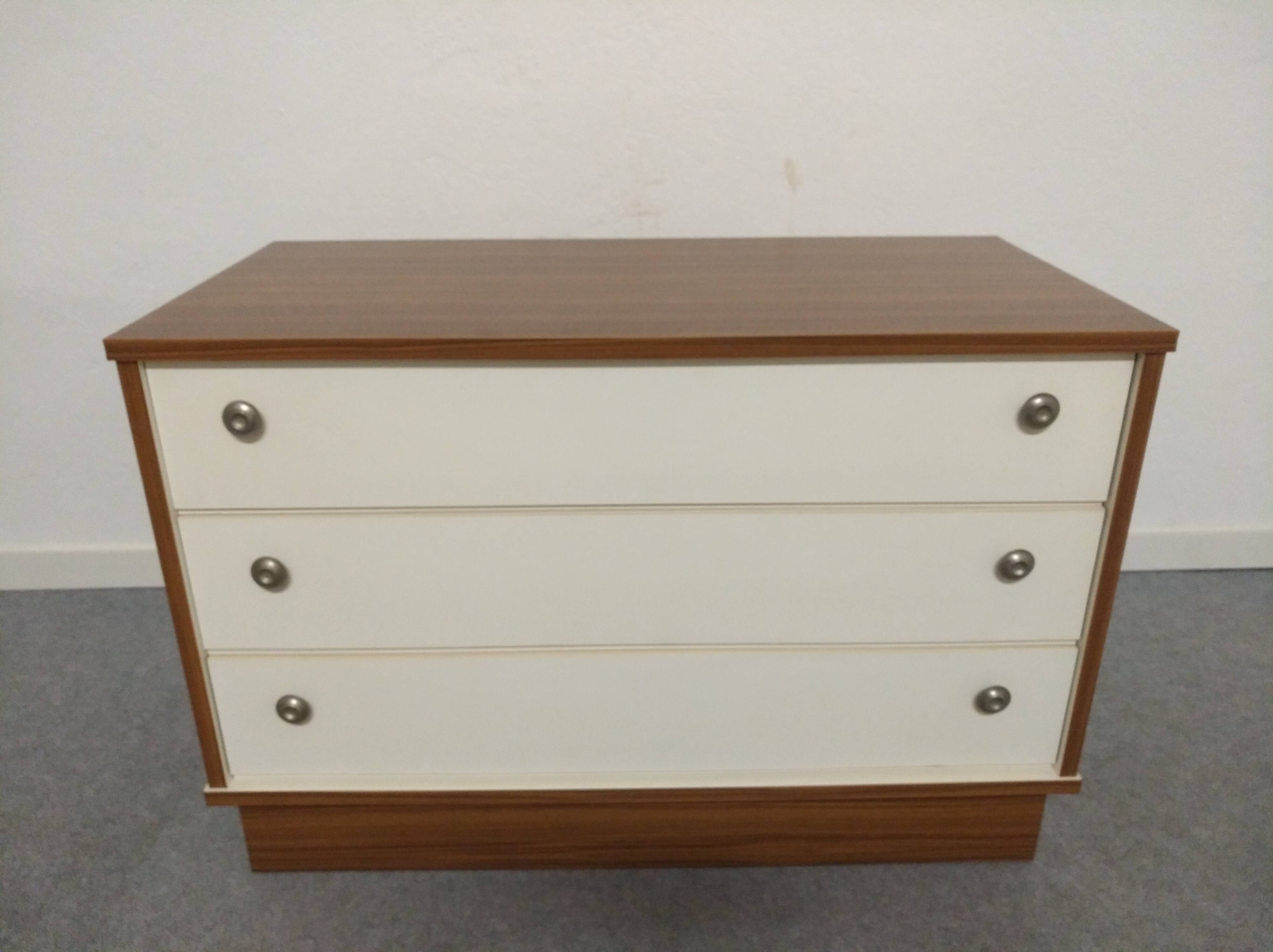Low chest of drawers with 3 drawers in mahogany and white satin, France circa 1980.
