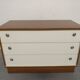 Low chest of drawers with 3 drawers in mahogany and white satin, France circa 1980.