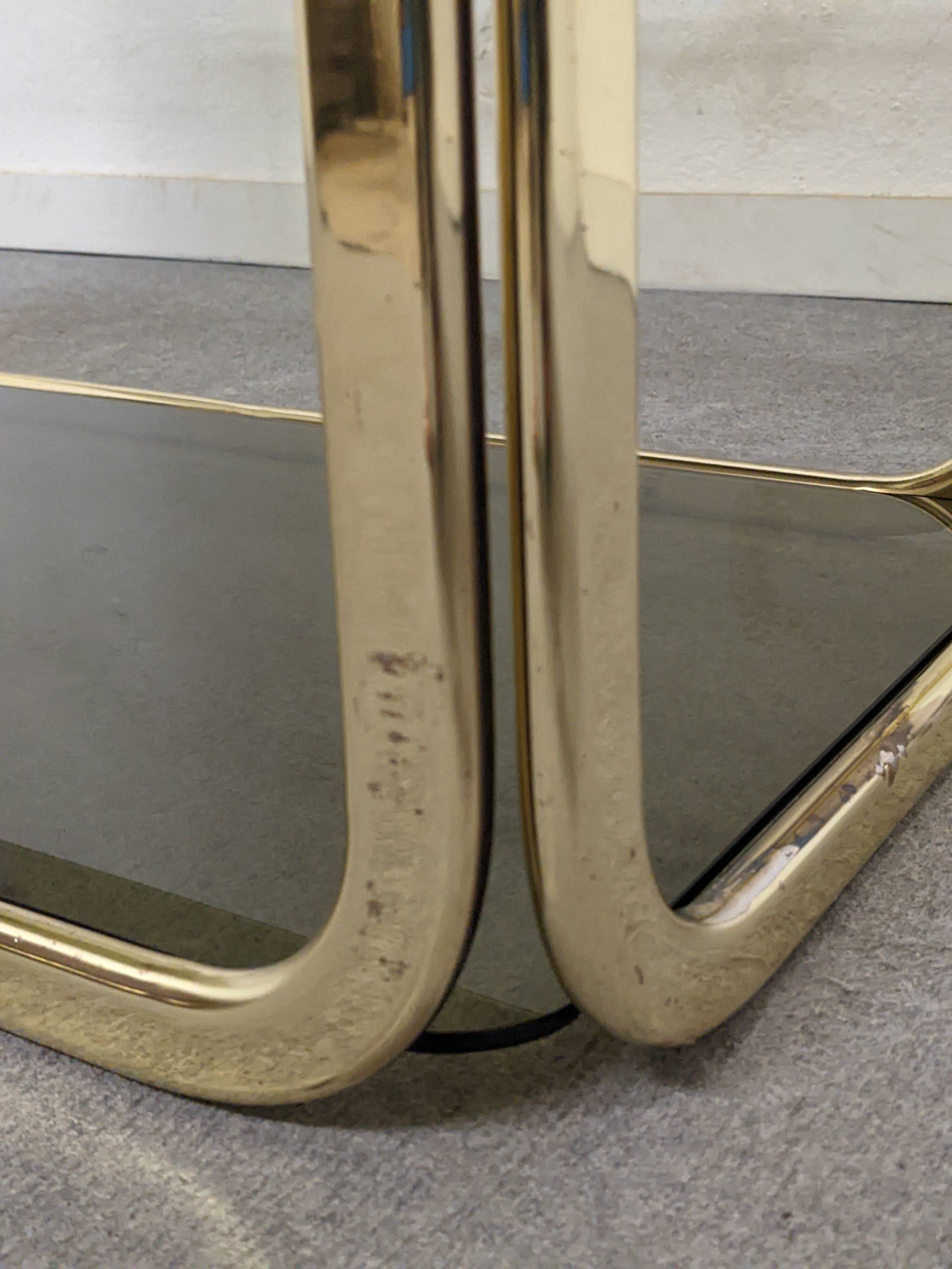 Hollywood Regency gilt metal and smoked glass shelf, Italy circa 1970