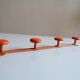 Vintage 70s orange lacquered metal 4-hook wall coat rack
