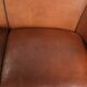 Sheepskin 2-seater sofa with a warm cognac brown colour scheme