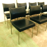 Suite of eight vintage chairs in chrome and imitation leather XX century