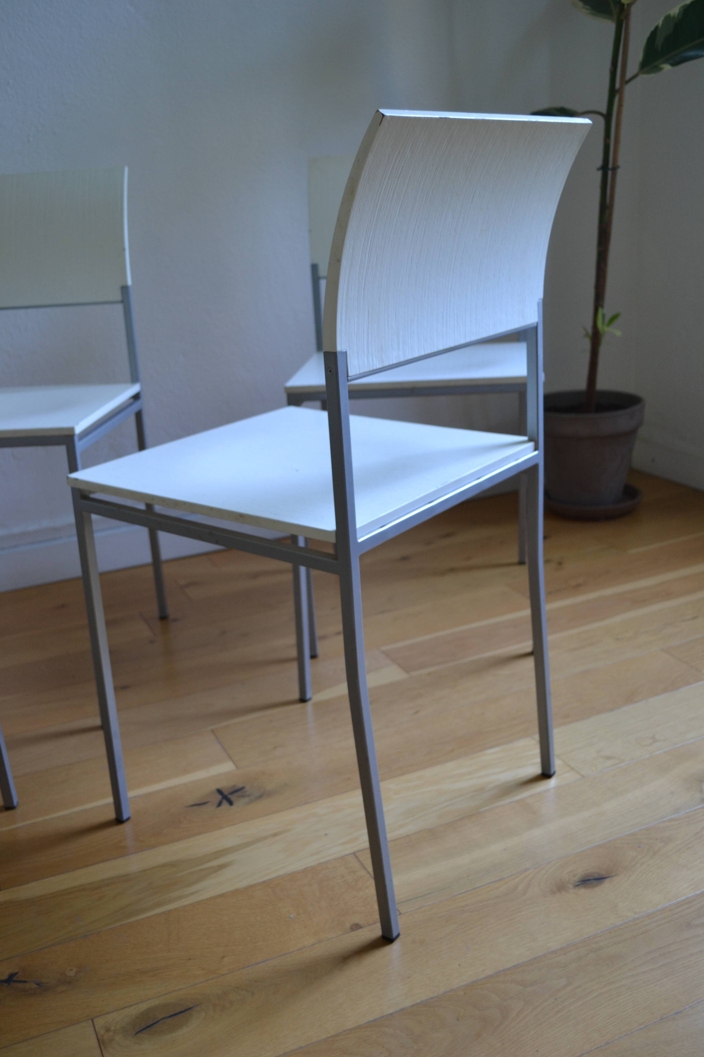 Set of 4 vintage metal and wood chairs from the 1990s.