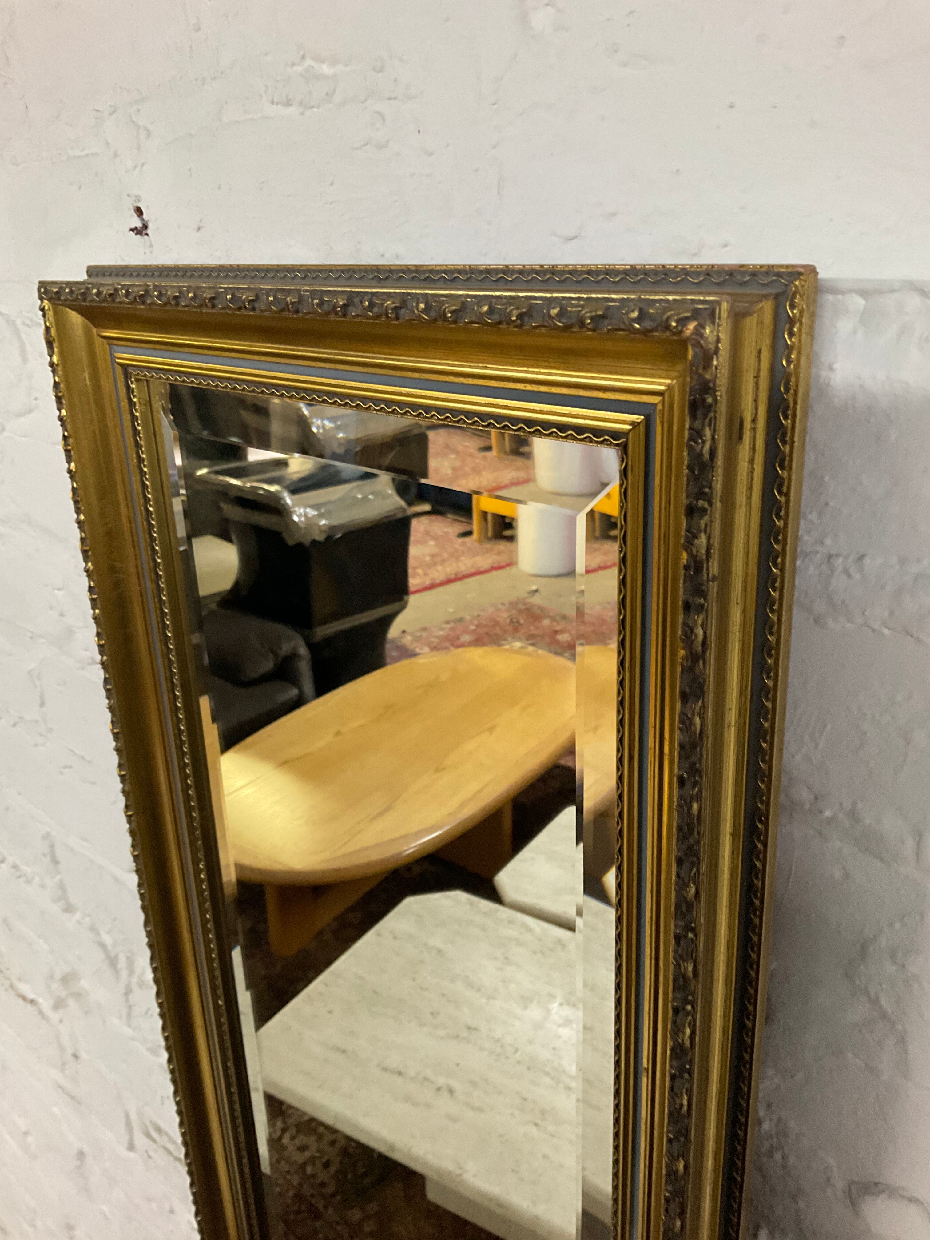 Vintage mirror in gilded wood and beveled glass
