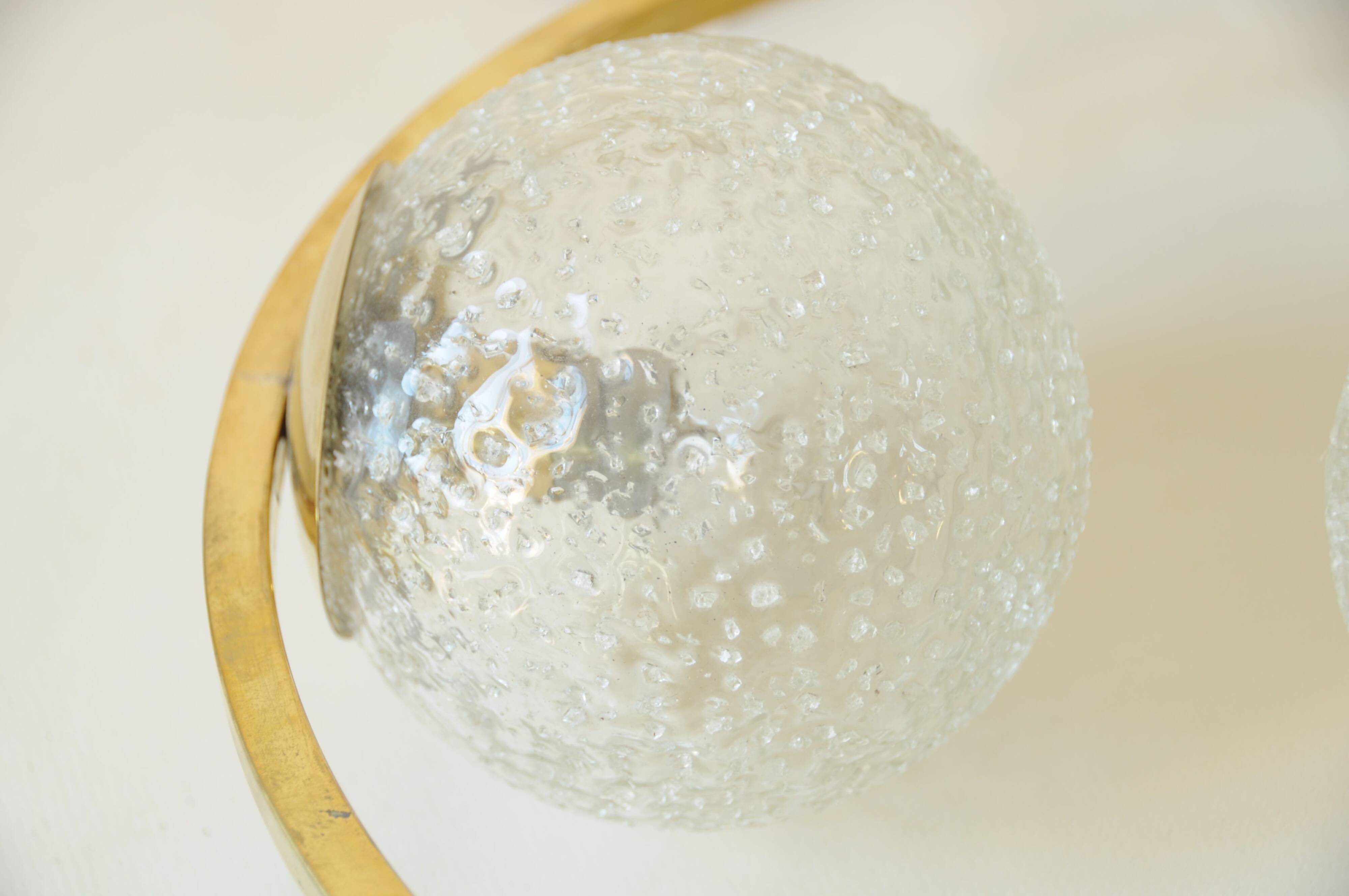 Mid century modernist pendant light in brass and textured glass ball