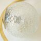 Mid century modernist pendant light in brass and textured glass ball
