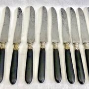 12 antique large table knives with ebony handles from the Napoleonic III period.