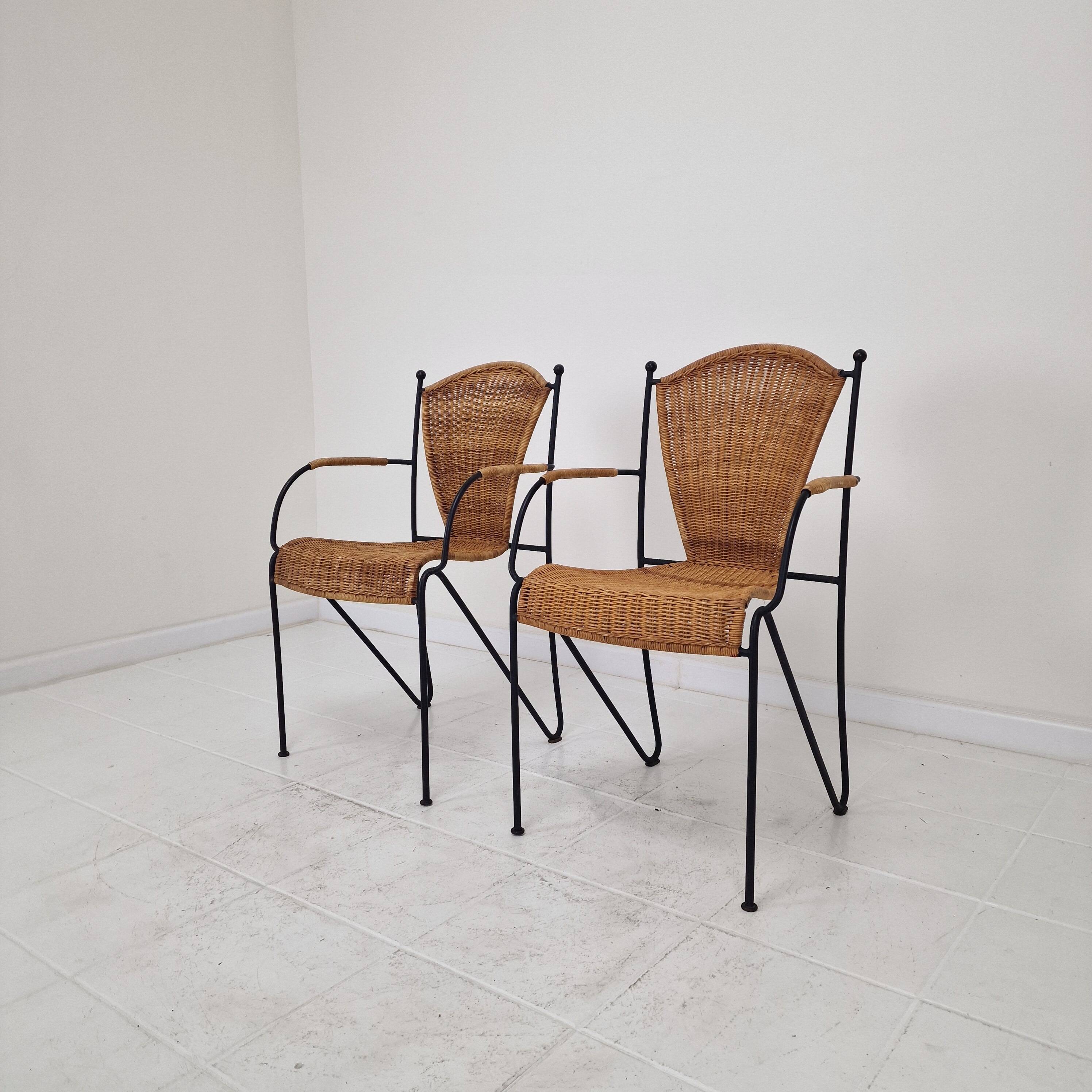 Pair of wicker and iron armchairs by Frederic Weinberg, United States, 1950s.