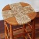 Antique wooden bar stool with a straw seat