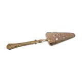 Old gold metal pie shovel