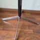 Chrome parrot coat rack with swivel head on a gas lift.
