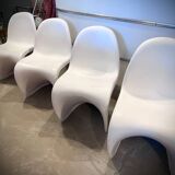 4 white Panton style armchairs