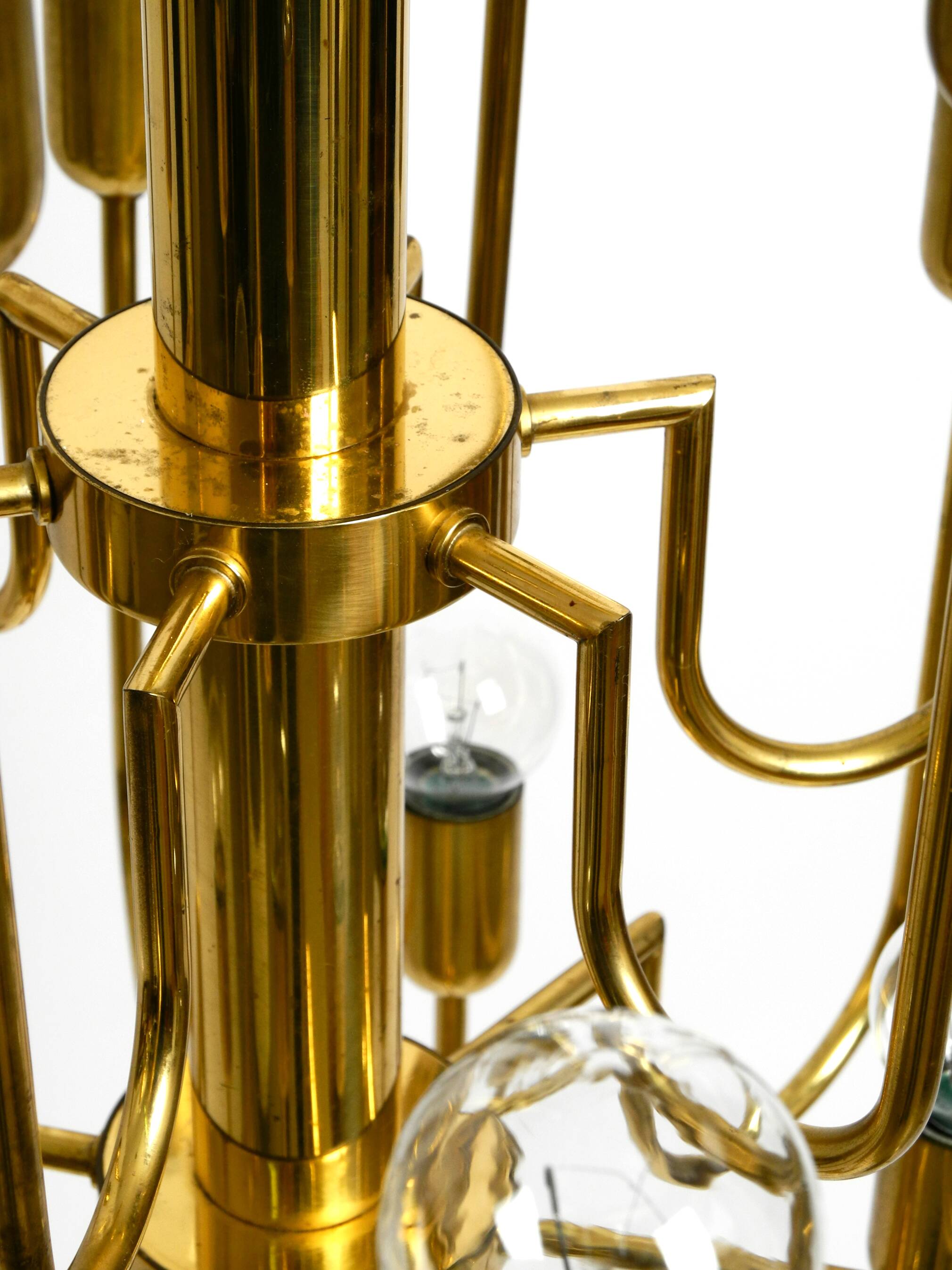 Three staged 18 arm Mid Century brass chandelier with a long brass rod