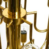 Three staged 18 arm Mid Century brass chandelier with a long brass rod