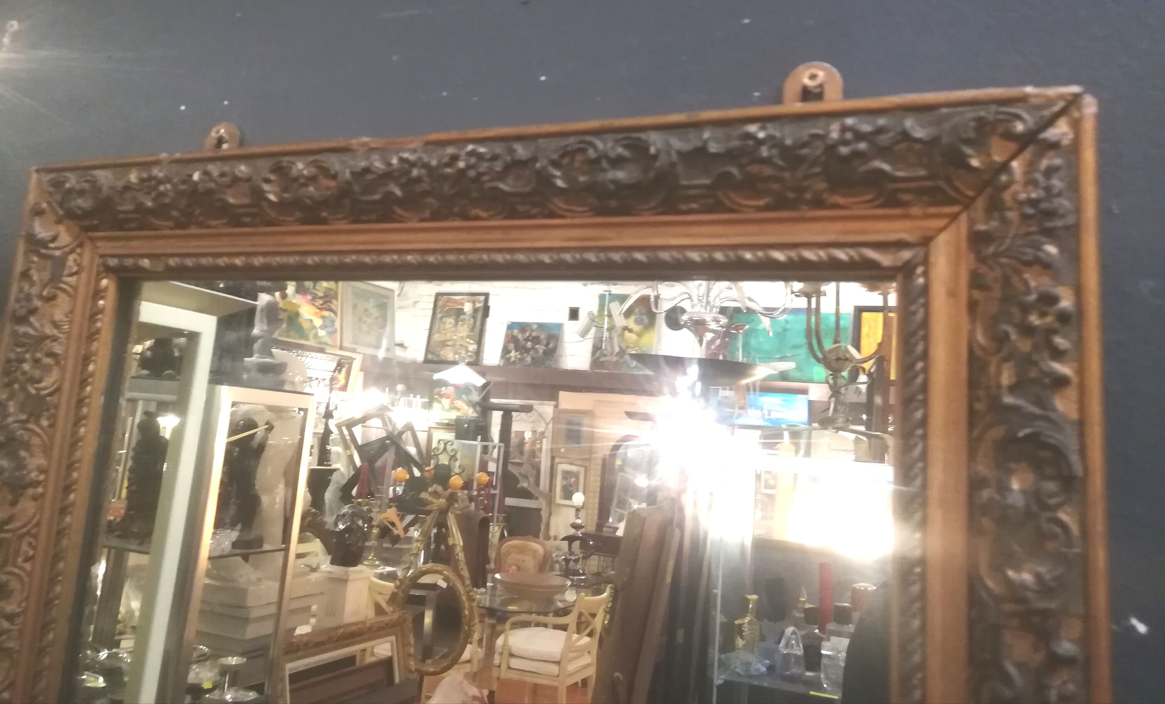High and narrow mirror in gilded stucco late nineteenth century
