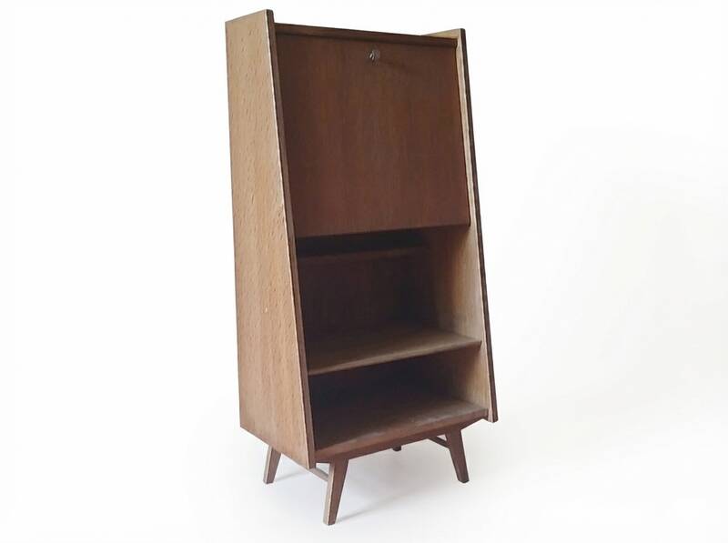 Vintage 1960s secretary desk with an angled design, light wood, and tapered legs.