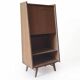 Vintage 1960s secretary desk with an angled design, light wood, and tapered legs.