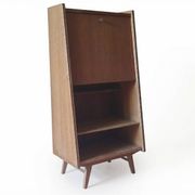 Vintage 1960s secretary desk with an angled design, light wood, and tapered legs.