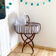 Vintage rattan cradle and its wheeled support