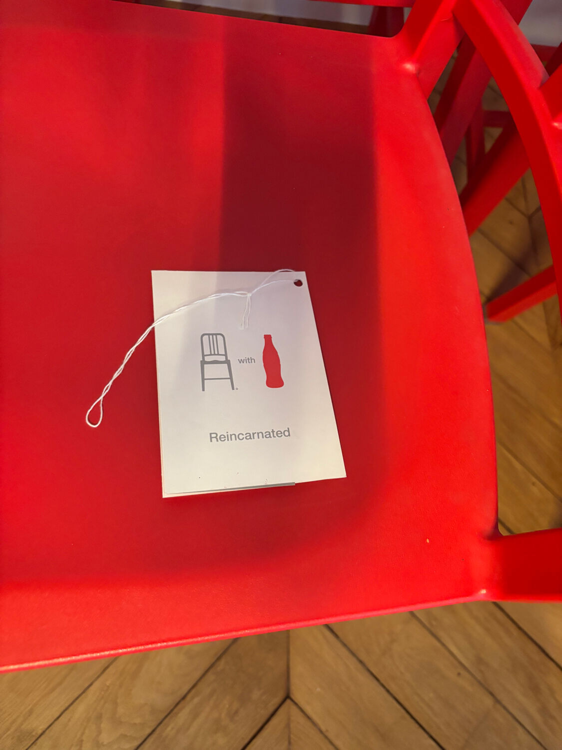 Set of 6 red Emeco chairs