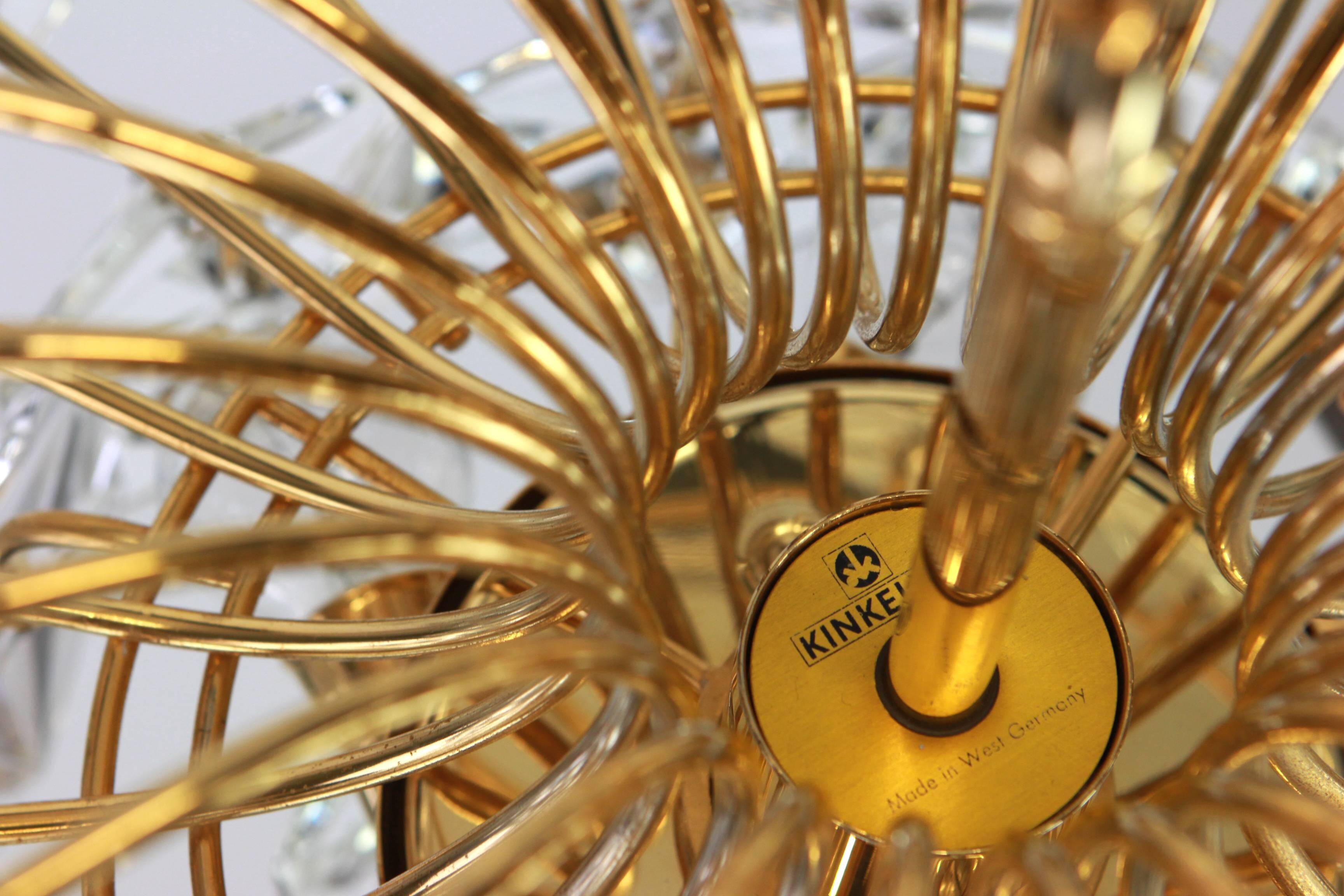 Chandelier in gilded brass and crystal glass by Kinkeldey, Germany, 1970s.