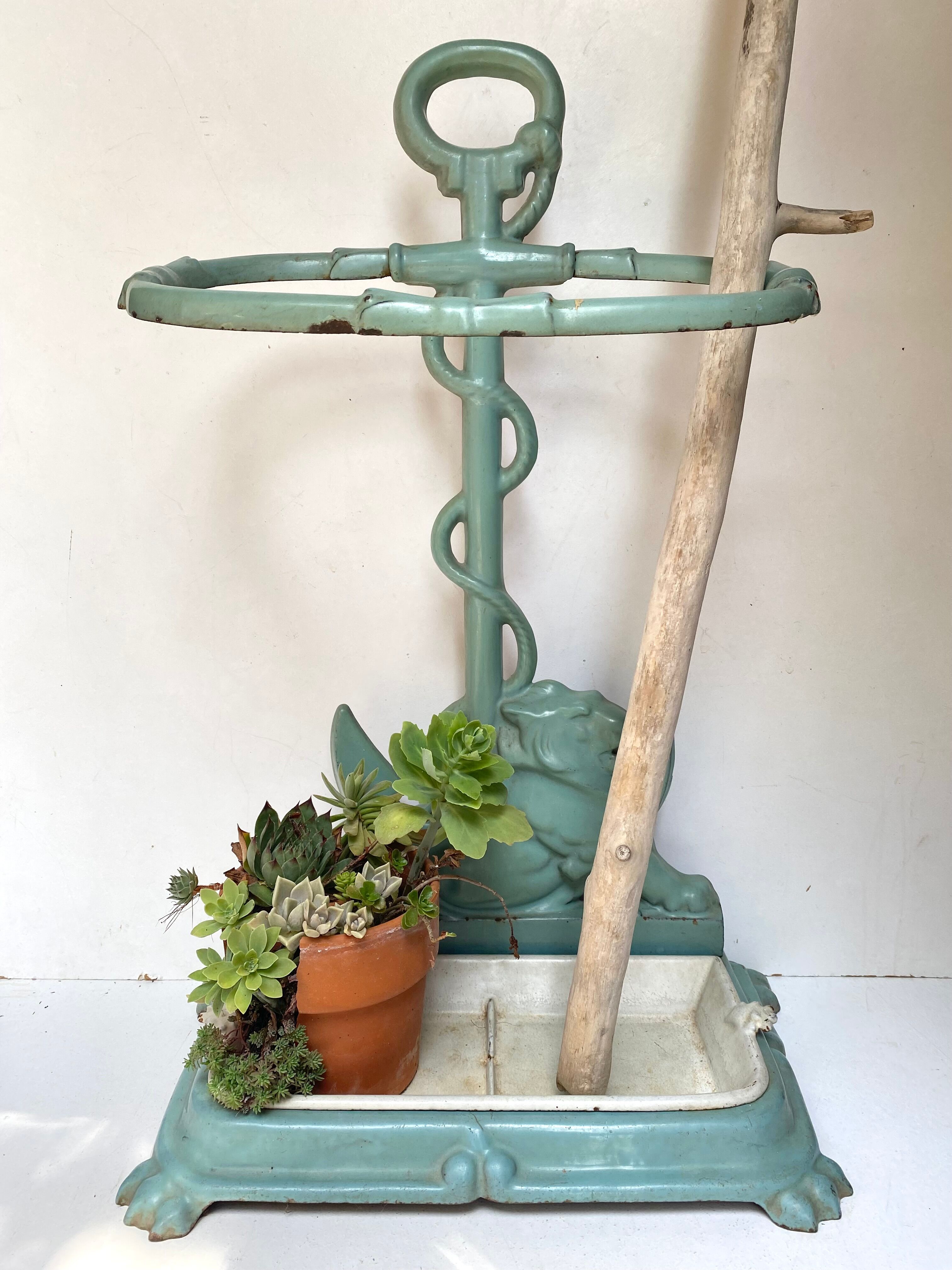 Enameled cast iron umbrella stand from the early 20th century