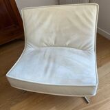 Two armchairs and a pop footstool from Roset