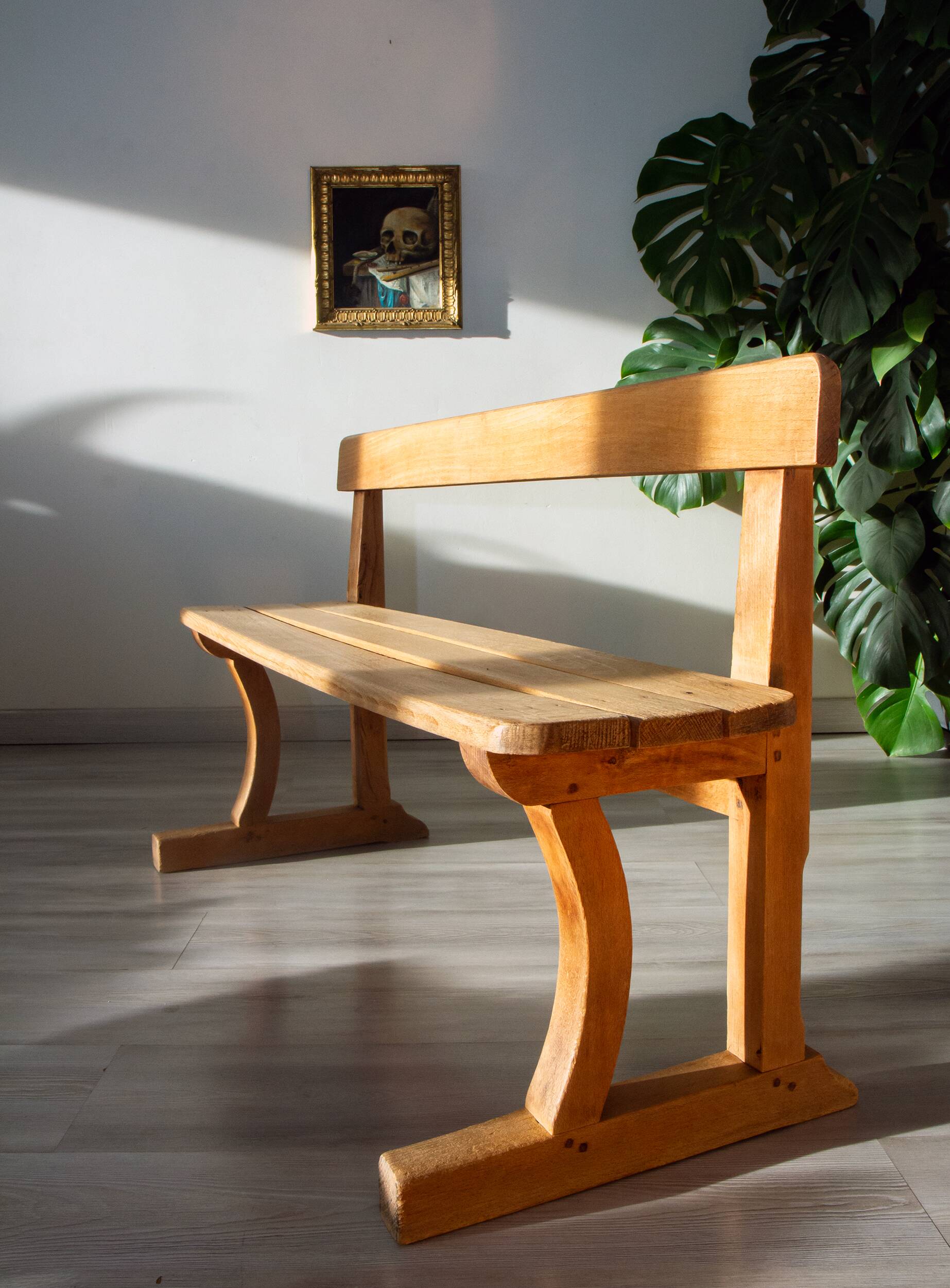 Solid wood school bench from the early 20th century.