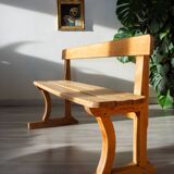 Solid wood school bench from the early 20th century.