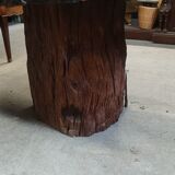 Round table carved from a wooden slice of PADOUK