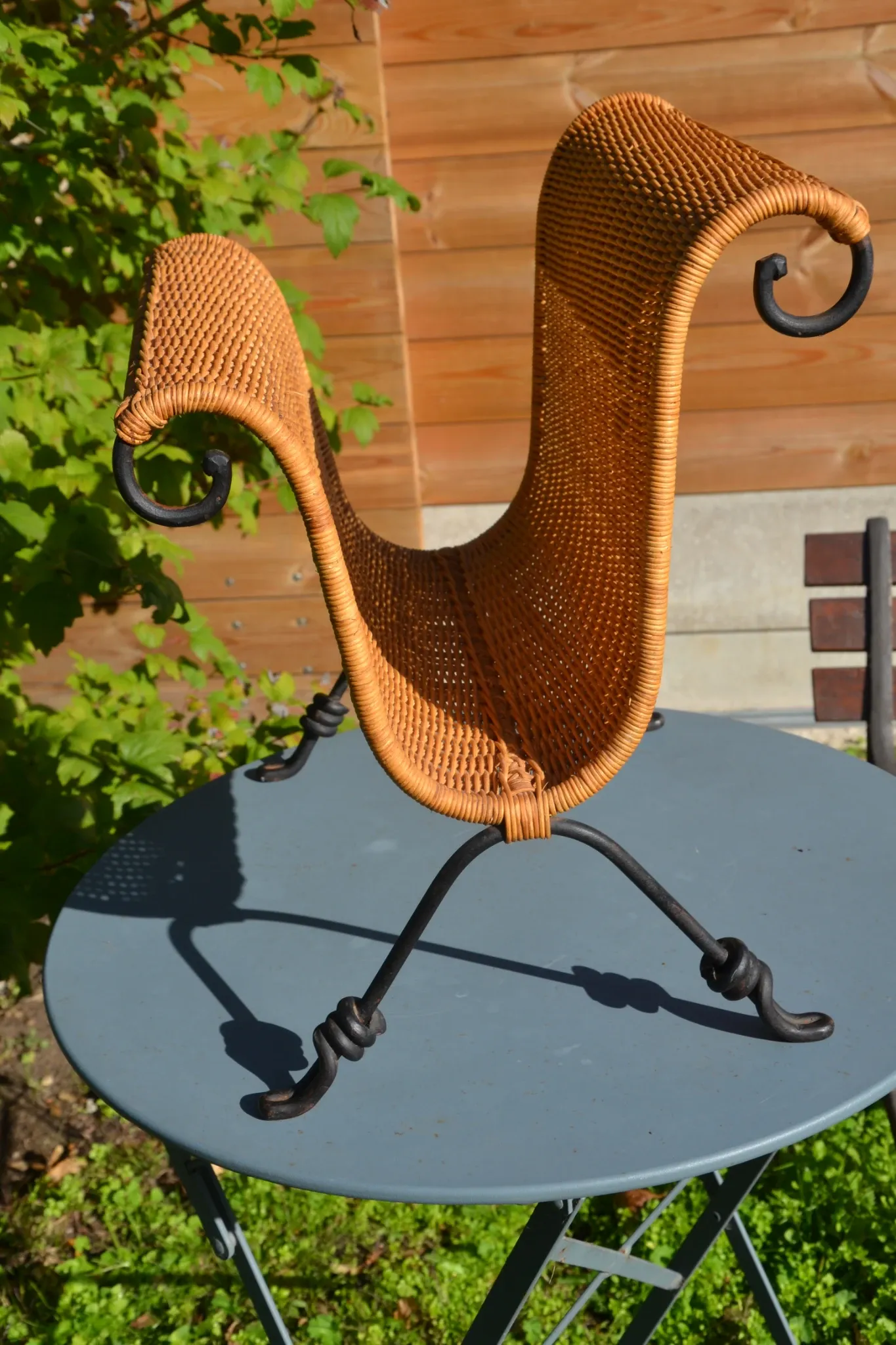 Wrought iron and rattan magazine/newspaper rack